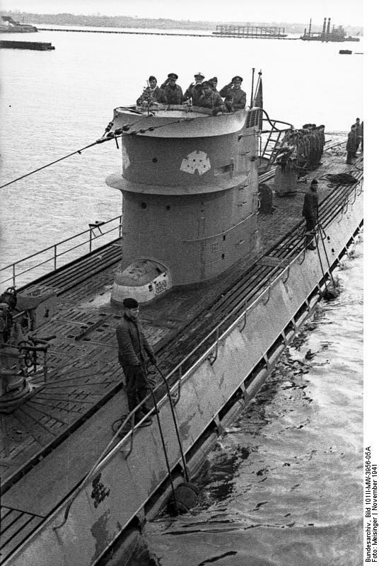 Men in conning tower on German submarine U-107 at Lorient, France, in November 1941