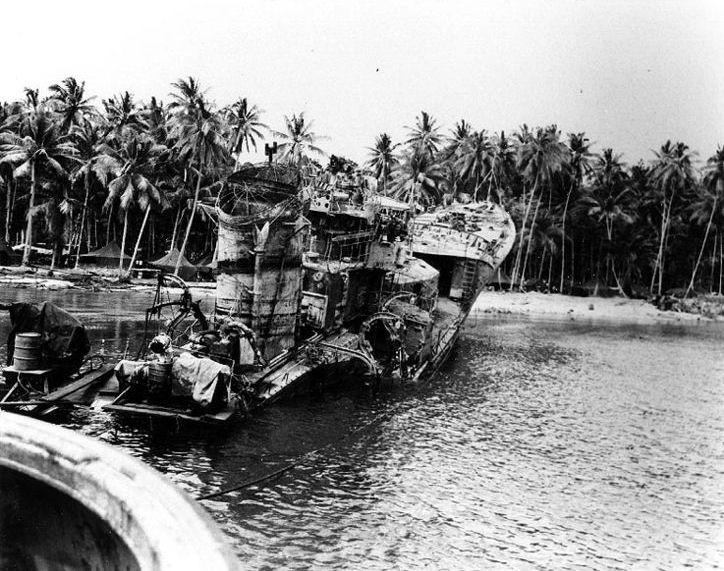 August 1943 photograph of the rusting hulk of Kikuzuki after U.S. forces dragged the wreckage onto the beach.