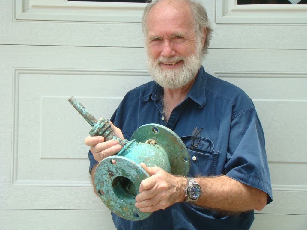 Dr. E. Lee Spence with brass valve from SS United States