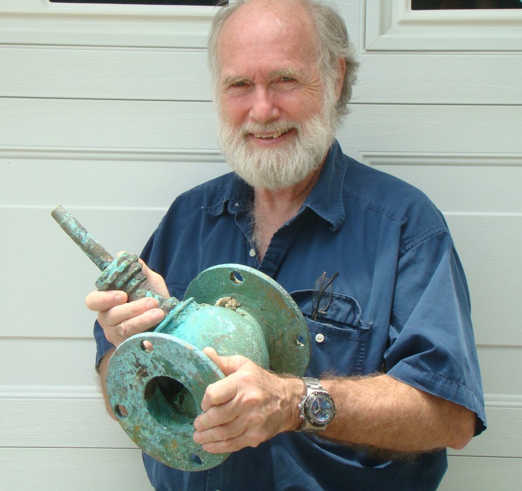 Dr. E. Lee Spence with brass valve from SS United States