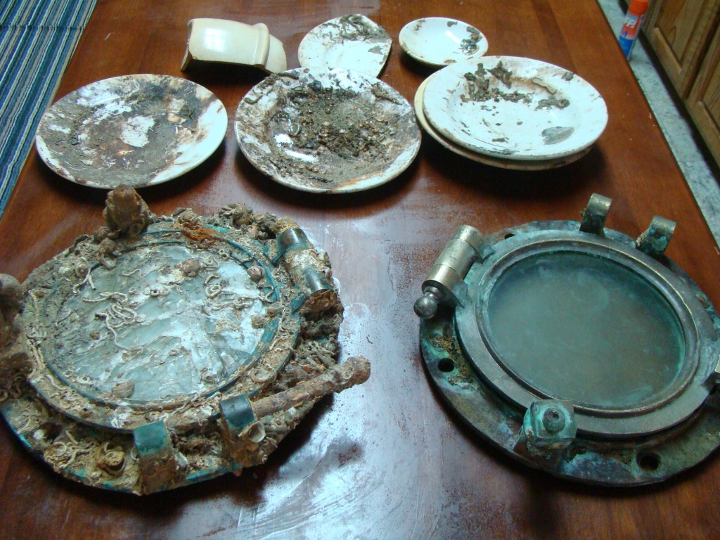 Portholes and china salvaged from the SS Ozama.