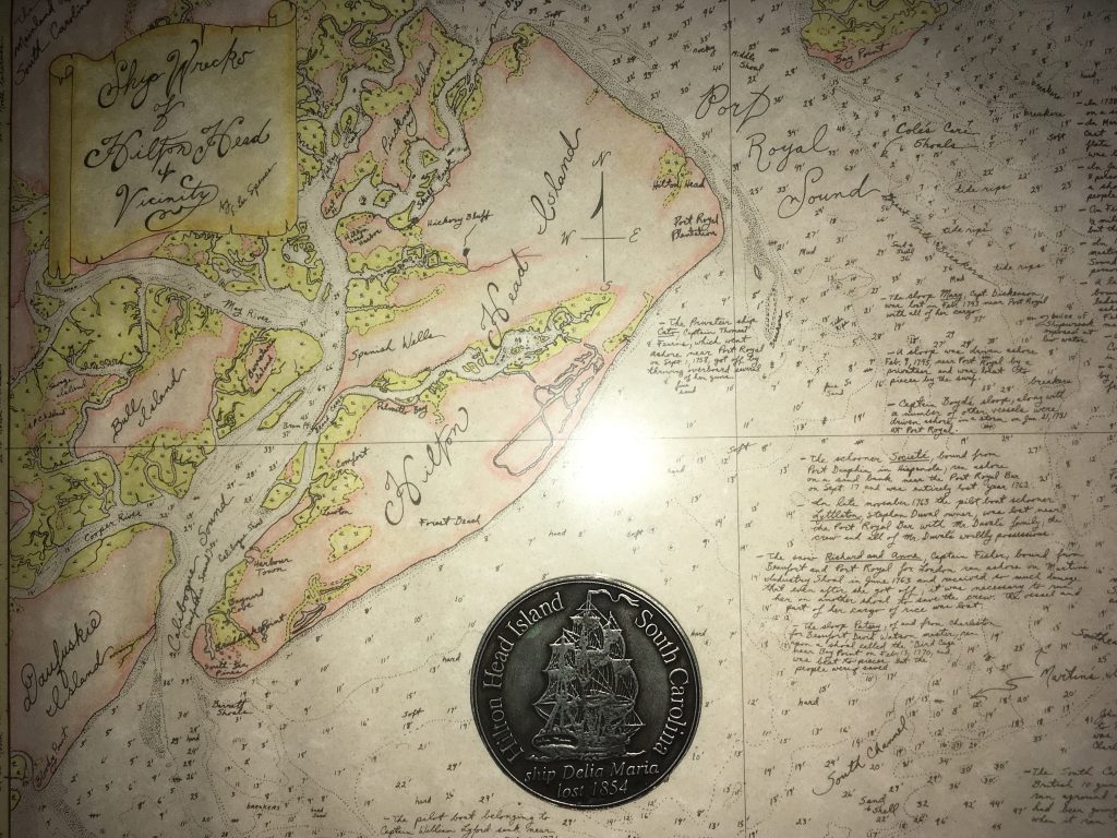 Medallion made by Dr. Spence commemorating the loss of the Delia Maria, rests over the approximate location of the wreck on Spence's map of "Shipwrecks of Hilton Head Island & Vicinity" 