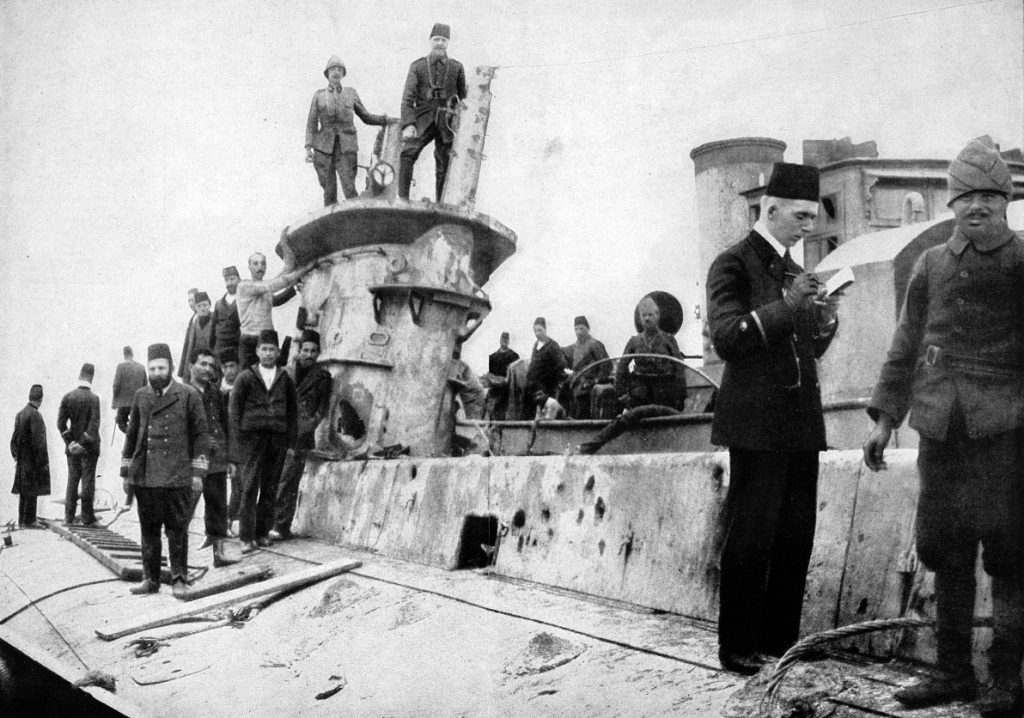 The stranded wreck of British submarine E15 being inspected by Turkish and German personnel
